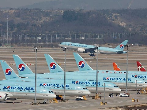 Korean Air's passenger planes are parked on the tarmac as overseas flight routes are reduced following the outbreak of coronavirus disease (COVID-19), at Incheon International Airport in Incheon, South Korea.