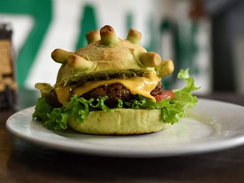 Eat it: Hanoi chef spreads joy with 'Coronaburger' 