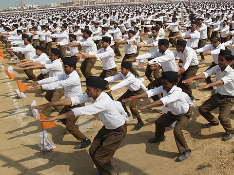 Meerut: RSS workers perform a drill during a rally organised by Rashtriya Swayamsevak Sangh, in Meerut on Sunday. PTI Photo (PTI2_25_2018_000166B)