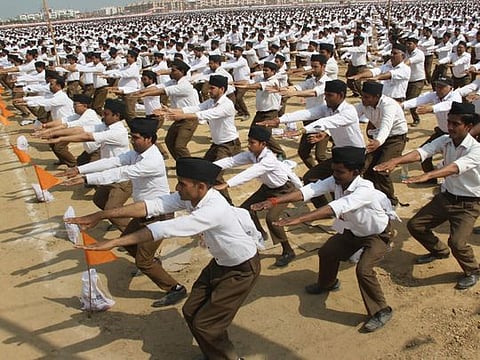 Meerut: RSS workers perform a drill during a rally organised by Rashtriya Swayamsevak Sangh, in Meerut on Sunday. PTI Photo (PTI2_25_2018_000166B)