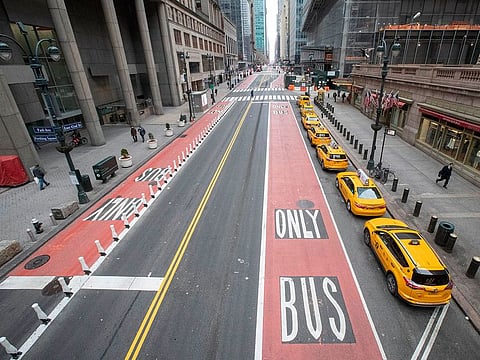 Yellow cabs line an empty 42nd St. waiting for fares outside Grand Central Terminal, in New York, during the coronavirus crisis