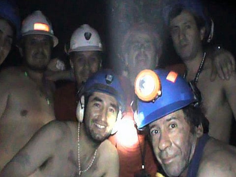 In this file photo taken on September 17, 2010 trapped Chilean miners pose inside the San Jose Mine near Copiapo, 800 km north of Santiago, Chile.