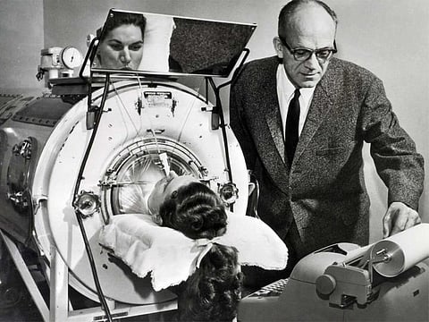 Polio was an ever-present threat for decades. Here, a  victim assisted by an Emerson Respirator, better known as an iron lung. 