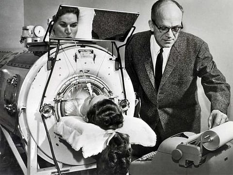 Polio was an ever-present threat for decades. Here, a  victim assisted by an Emerson Respirator, better known as an iron lung. 