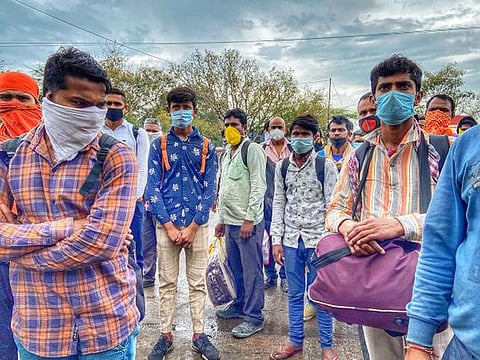 Chandra Mohan, right, a plumber working in a Delhi suburb, is walking to his village, 680 miles away in another state. Hundreds of migrants like him have been forced to leave the capital as jobs have disappeared (File)
