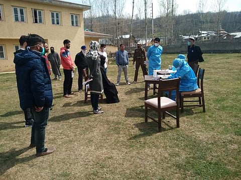 GMC hospital staff check people in Srinagar.
