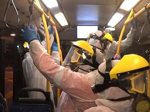 A public transport bus in Dubai being disinfected overnight during the National Sterilisation Drive to fight COVID-19 in the UAE.