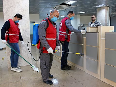 Members of Red Crescent spray disinfectants, as part of precautionary measures against coronavirus disease (COVID-19) at government offices in Misrata, Libya. 