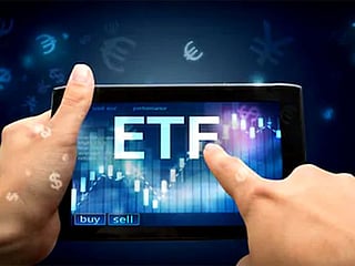 How can one go about investing in exchange-traded funds (ETFs)? What are the key perks and risks?