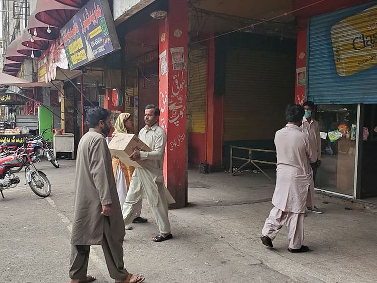 People get their grocery packs