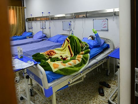 An Iraqi coronavirus patient rests at a special ward at the Hakim Hospital in Najaf on March 25.