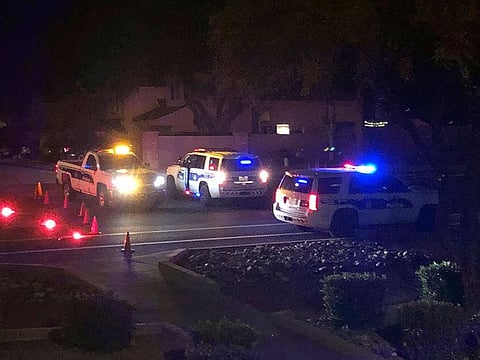 Officers secure a scene of a shooting in Phoenix, Ariz., Sunday, Mar. 29, 2020. At least three Phoenix police officers were shot Sunday night on the city's north side, authorities said. 