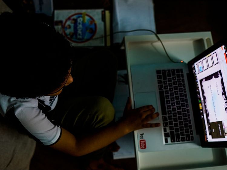 A student using their computer for e-learning 