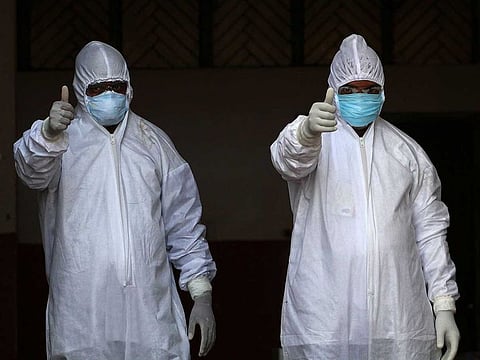 Medical staff wearing protective gear prepare to test people, who attended a religious event at Nizamuddin Markaz in New Delhi where many have tested COVID-19 coranavirus positive, in Allahabad on April 1, 2020. 