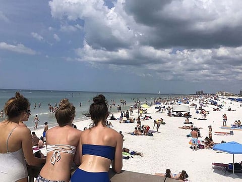 People gather at Clearwater Beach in Florida.