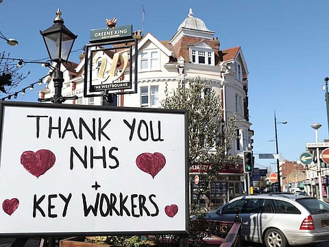 A sign thanking NHS staff and key workers is displayed outside The Westbourne pub in Bournemouth, south England as the UK continues in lockdown to help curb the spread of the coronavirus Wednesday April 1, 2020.