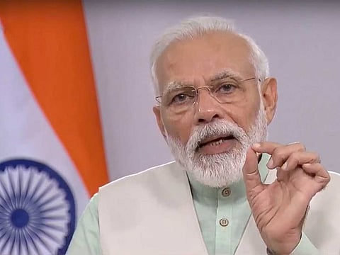 Prime Minister Narendra Modi addresses the nation on COVID-19 via a video message, in New Delhi, Friday, April 3, 2020. Modi urged people to switch off lights in their homes at 9pm for nine minutes on April 5 and light up lamps, candles, mobile flashlights to display the nation's collective spirit to defeat coronavirus.
