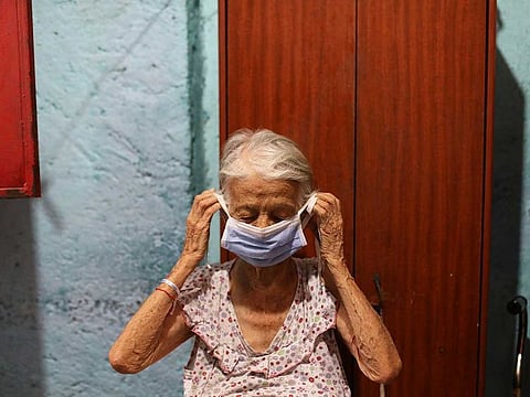 Maria Araque, 90, puts on a protective mask at her house during the nationwide quarantine due to the coronavirus disease (COVID-19) outbreak in Caracas, Venezuela March 25, 2020. Picture used for illustrative purposes only.