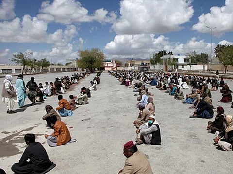 People are waiting to Quetta to receive ration as businesses close due to partial lockdown in Balochistan. 