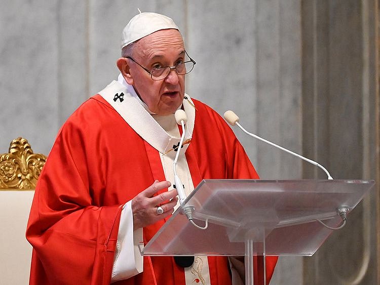 Pope Francis speaks as he leads Palm Sunday mass in St Peter's Basilica without public participation due to the spread of coronavirus 