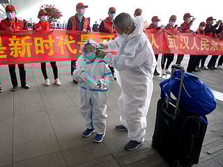 COVID-19: As Wuhan reopens, people begin to venture outside