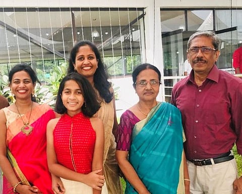 Susan Thomas (centre) with her family in happier times.