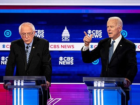 Sen. Bernie Sanders and former Vice-President Joe Biden during the Democratic presidential debate at the Gaillard Center in Charleston, S.C., on Feb. 25, 2020. Having become the presumptive Democratic presidential nominee, Biden and his allies are aiming to win over Sanders’s younger, more liberal voters and unify the party.