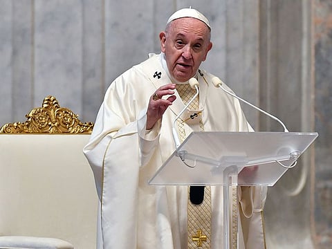 Pope Francis delivers a message during a Mass inside St. Peter's Basilica at the Vatican.