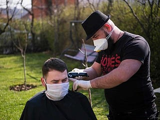 Kosovo's travelling barber keeps hair trimmed in COVID-19 lockdown