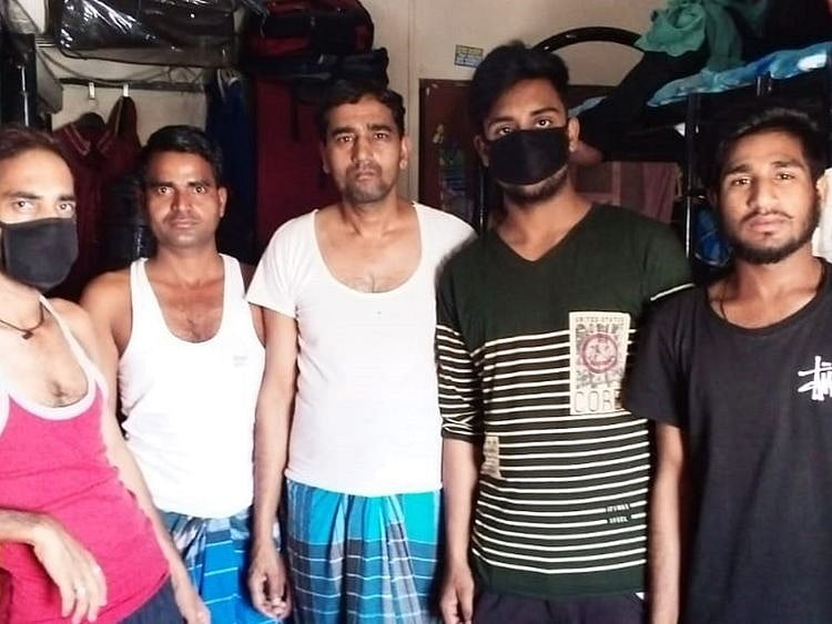 A group of Indian men at their Sharjah accommodation from where they were evicted over unpaid rents on Saturday Supplied