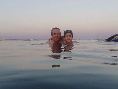 This undated photo from 2016 shows Dr. Ahmed Al Lawah  and his son during a vacation in Egypt. Al Lawah died on March 30 after he was infected by the new coronavirus. He was the first doctor to die from the COVID-19 in Egypt. 