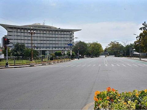 A deserted view of the Mall Road, one of Lahore's busiest roads, as people restrict their movements due to lockdown in the Punjab province to combat COVID-19 outbreak.