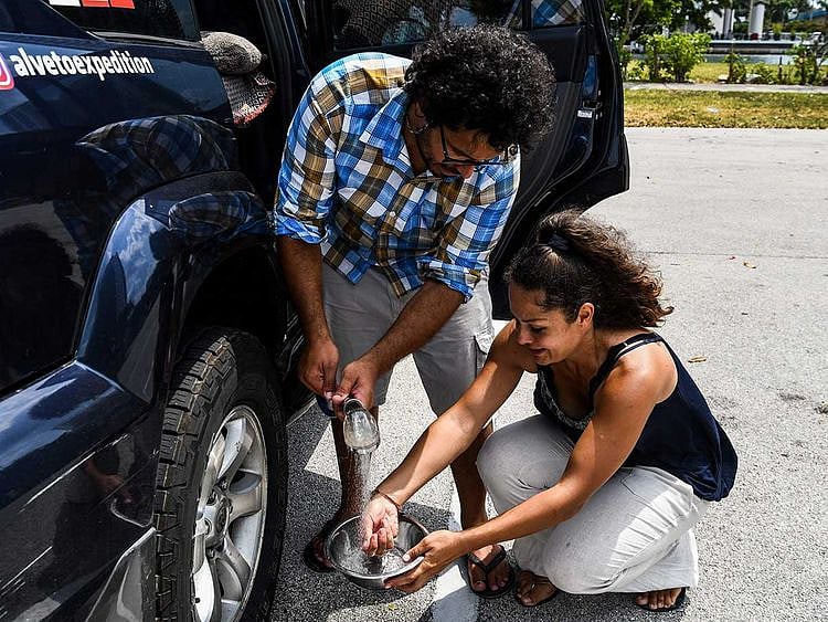 Italian chef Aldo Giaquinto (L) and his wife Vera Kozlovskaia  stranded in Florida globetrotters