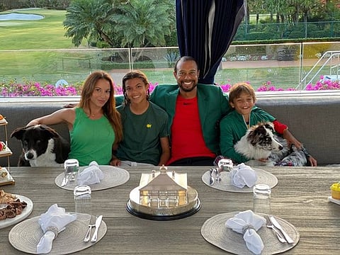 Tiger Woods with his son Charlie, daughter Sam Alexis and partner Erica Herman