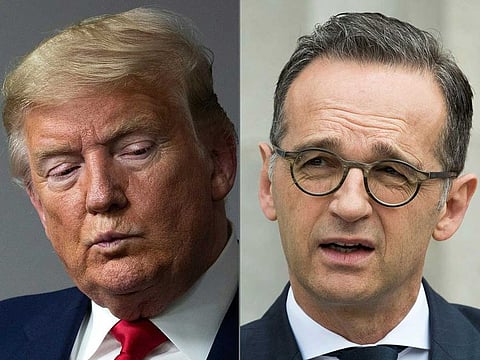 This combination of file pictures created on April 15, 2020 shows US President Donald Trump (L, at the White House on April 3, 2020 in Washington, DC) and German Foreign Minister Heiko Maas (in Berlin on May 31, 2019). Germany slammed on April 15, 2020 the US decision to suspend payments to the World Health Organization (WHO), as Foreign Minister Heiko Maas warned against "blaming others" for the coronavirus crisis. US President Donald Trump announced the funding freeze on Tuesday, April 14, 2020, accusing the WHO of "severely mismanaging" the spread of the virus. 