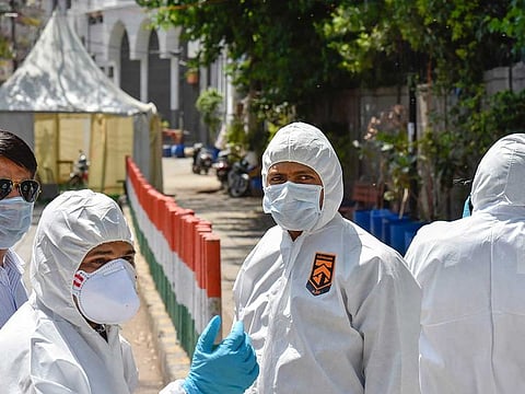Forensic officials arrive at Nizamuddin Markaz to conduct an investigation, during the nationwide lockdown to curb the spread of coronavirus, in New Delhi, Sunday, April 5, 2020. 