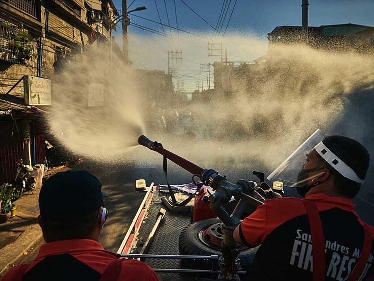 Manila Firefighters spray disinfectant lockdown Luzon