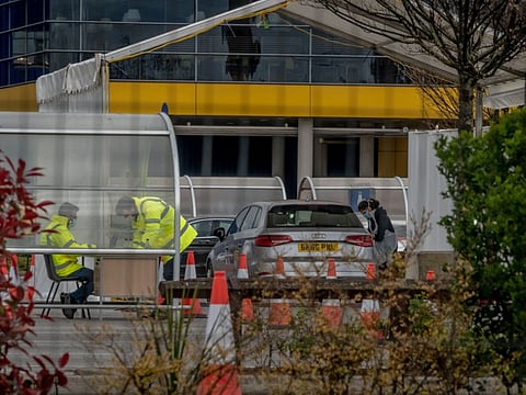 A drive-through coronavirus testing location in London, April 2, 2020. Facing a global scramble for materials, British officials bought millions of unproven kits from China in a gamble that became an embarrassment. (Andrew Testa/The New York Times)