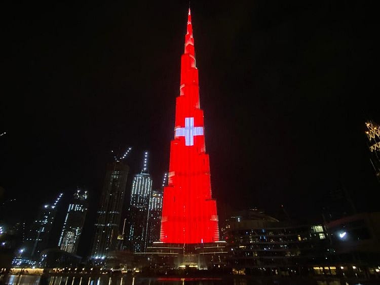 Dubai’s Burj Khalifa lights up in colours of the Swiss flag as a thank you to Switzerland for projecting the UAE flag on the Matterhorn mountain in Switzerland.