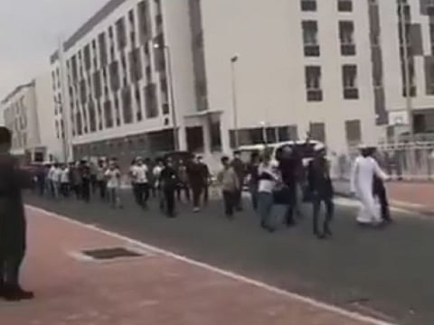 About 150 patients who recovered from COVID-19 cheer medical workers and volunteers follows weeks of stay in a quarantine facility in Dubai's Warzan district. 