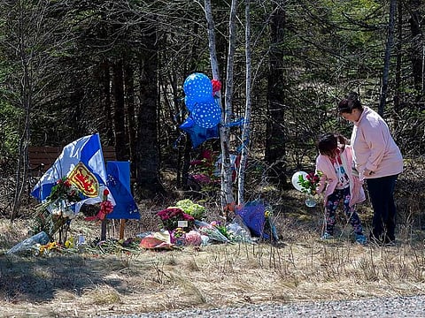 A memorial pays tribute to Heather O’Brien, a victim of this past weekend shootings along the highway in Debert, Nova Scotia, on Tuesday, April 21, 2020.