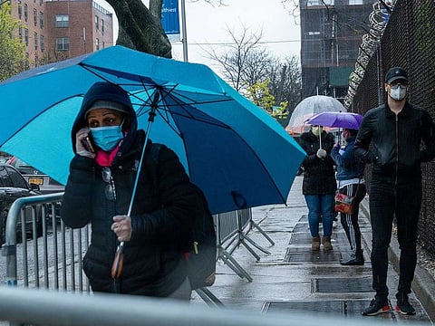 People stand in line at NYC Health + Hospitals/Gotham Health, Belvis to be tested for the coronavirus (COVID-19) on April 24, 2020, in the Bronx borough of New York City. The NYC Health + Hospitals/Gotham Health, Belvis is one of the newest sites specifically for NYCHA city housing residents to open for diagnostic testing in some of the hardest-hit areas in New York City.