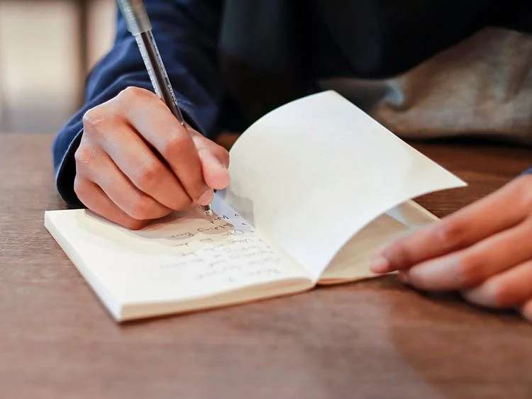 OPN 200424 Man writing-1587723396694
