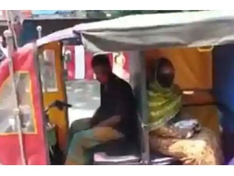 Rickshaw driver ensures riders are practicing social distancing