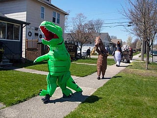Look: The T-Rex Walking Club parades in Michigan
