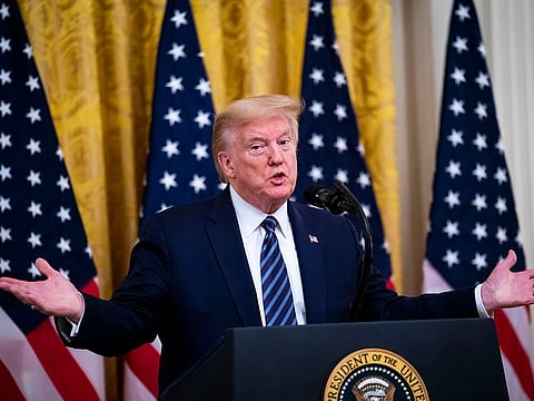 US President Donald Trump delivers remarks at the White House in Washington.