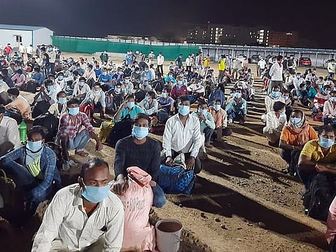 Passengers wait to board the train at Lingampalli railway station, in Hyderabad on Friday. A one-off special train was run from Lingampalli (Hyderabad) to Hatia (Jharkhand) on the request of the Telangana government and as per the directions of Union Railway Ministry. 