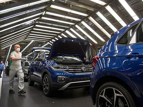 Employees wearing face masks work at the Volkswagen Navarra factory after the Volkswagen Group's Audi brand started operations at the plant in Pamplona on April 30, 2020, during a national lockdown to prevent the spread of the COVID-19 disease. Spain counted another 268 people who have died from the coronavirus, the lowest daily number since March 20 as the country prepares to ease its tough lockdown measures. Spain's nearly 47 million people have since March 14 lived under one of the strictest virus lockdowns in the world, with only adults authorised to leave home to buy food, medicine or walk the dog.  
