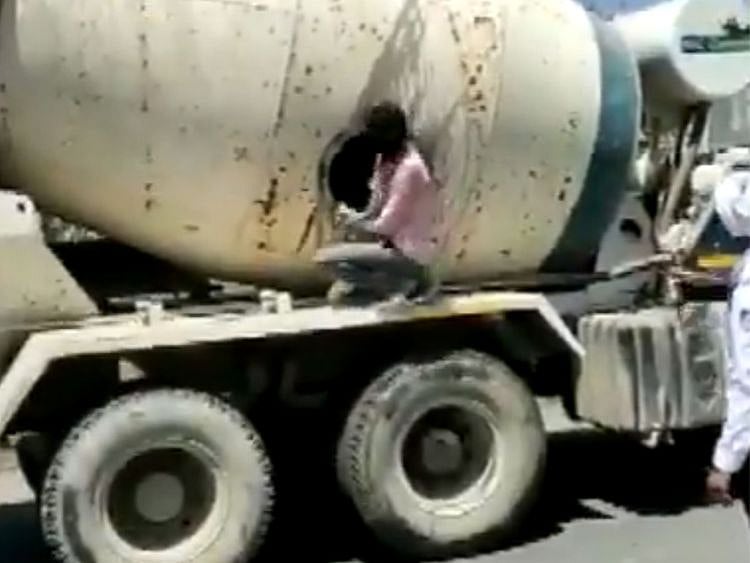  Watch: 18 people found travelling in concrete mixer truck in Indore