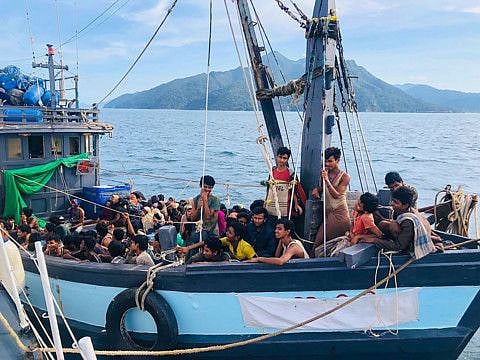 This picture, taken in April, shows a wooden boat carrying Rohingya migrants being detained in Malaysian territorial waters off the island of Langkawi. At least three boats carrying Rohingya refugees have been adrift for more than two months. 